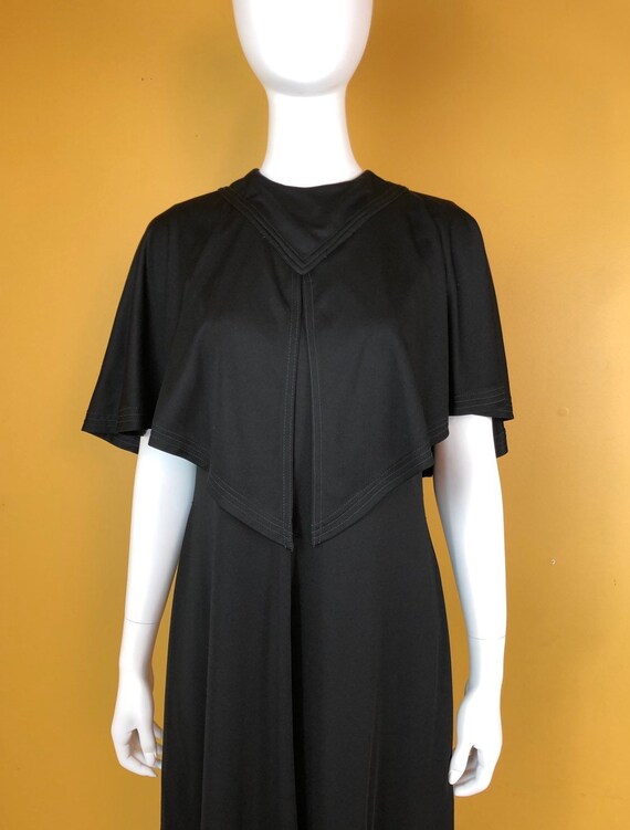 black dress with cape attached