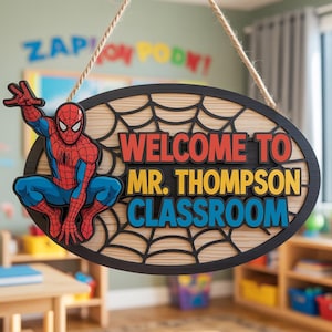 May include: An oval wooden classroom sign featuring Spider-Man and the text "WELCOME TO MR. THOMPSON CLASSROOM" in red, yellow, and blue. The sign has a black border and a spiderweb design.