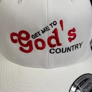 May include: White baseball cap with a red embroidered logo that says "Get Me To God's Country".