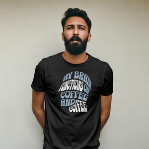 May include: A black t-shirt with a white and blue graphic that says "My brain functions on coffee and coffee".