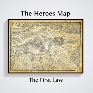 May include: A framed map labelled "The Heroes Map", with the text "The Valley of Osrung" and "The First Law". The map is a detailed illustration in shades of brown and tan, depicting a landscape with mountains, rivers, and settlements. The frame is black.