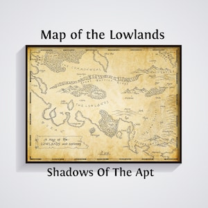 May include: Framed map titled "Map of the Lowlands" with the text "Shadows Of The Apt" at the bottom. The map is in sepia tones, featuring detailed illustrations of landmasses, geographical features, and text labels. The frame is black.