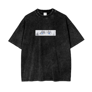 May include: Black t-shirt with a faded look featuring a close-up image of a pair of blue eyes.