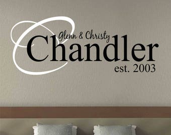 May include: Black and white wall decal with the text "Glenn & Christy Chandler est. 2003" and a decorative swirl design.