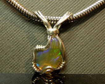 9531 Precious Opal Pendant hand made Ethiopian Welo Opal pendant  artisan cut and set wire wrap pendants from thegemdealer