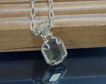3054 Andalusite Pendant  wire wrapped faceted andalusite pendant  artisan wire wrapped hand made wire wrapped andalusite from thegemdealer