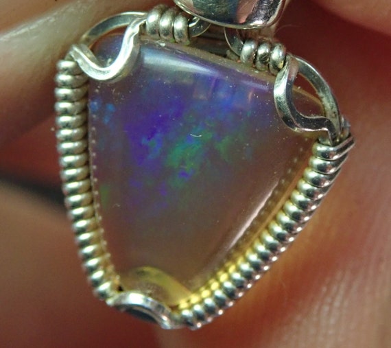 2083 Crystal Opal Pendant wire wrapped Welo Ethiopian opal pendant hand made wire wrapped Ethiopian opal pendant  pendants from thegemdealer