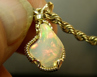1126 Precious Opal Pendant  hand carved and wire wrapped Ethiopian Welo opal 2.5 ct Welo opal minimalist wire wrap from thegemdealer