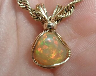 2082 Wire Wrapped Opal Pendant hand made Ethiopian Welo opal pendant hand crafted Welo opal pendant  wire wrapped jewelry from thegemdealer
