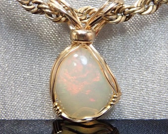 9816 Precious Opal Pendant wire wrapped Ethiopian Welo opal pendant hand made wire wrapped Ethiopian Welo opal pendant from thegemdealer