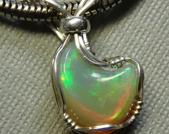 9765 Welo Opal Pendant  wire wrapped precious Ethiopian Welo opal pendant  hand cut and wrapped  wire wrapped opal jewelry from thegemdealer