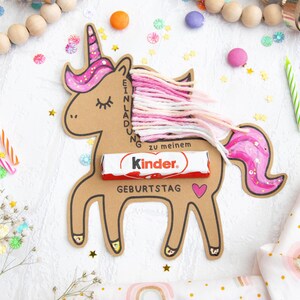 May include: A pink and brown unicorn birthday invitation with a Kinder chocolate bar and the text "Einladung zu meinem Geburtstag".