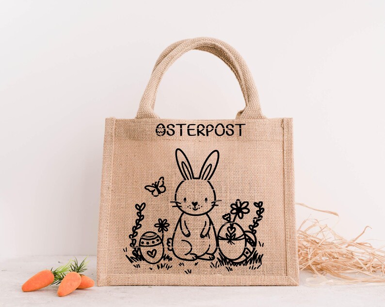 May include: A brown burlap tote bag with black handles and a black bunny rabbit design. The bag has the text "OSTERPOST" printed on the front.