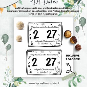 May include: A digital PDF file template featuring two rectangular labels with the German text 'M&ouml;ge das neue Jahr dir viele kleine 2 27 und gro&szlig;e Gl&uuml;cksmomente schenken!' and illustrations of fireworks, a pig, and a ladybug, with instructions for printing and assembly.