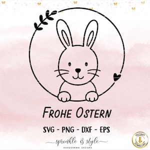 May include: A black and white line drawing of a bunny inside a circle with the words "Frohe Ostern" and "SVG - PNG - DXF - EPS" below. The design includes a floral element and a heart. The background is a soft pink watercolor wash.
