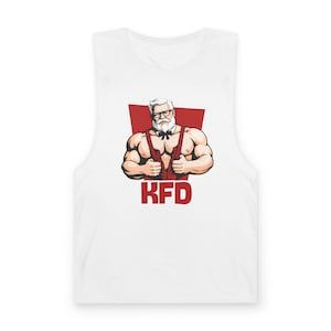 May include: White muscle tank top featuring a cartoon illustration of a muscular man with a white beard, glasses, and a red bow tie. The man is wearing red suspenders and the letters "KFD" are printed in red below.