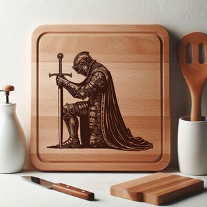 May include: A wooden cutting board with a laser engraved design of a knight kneeling with a sword. The knight is wearing armor and a cape. The board is brown and has a natural wood grain.