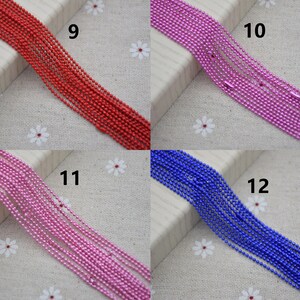 May include: Four spools of metallic chain in red, pink, blue, and purple. The spools are labeled with numbers 9, 10, 11, and 12.