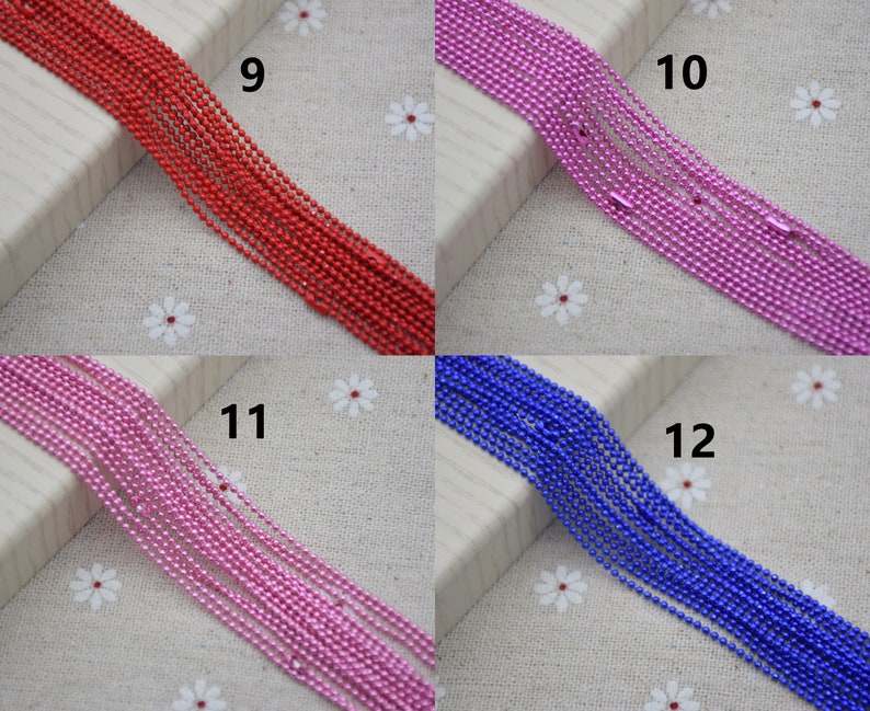 May include: Four spools of metallic chain in red, pink, blue, and purple. The spools are labeled with numbers 9, 10, 11, and 12.