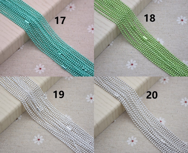 May include: Four spools of chain, each with a different color: turquoise, green, silver, and white. The spools are labeled 17, 18, 19, and 20.
