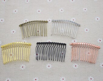 May include: Five hair combs in different colors: gold, silver, black, rose gold, and copper. The combs are all the same size and shape, with a curved design and a row of teeth.