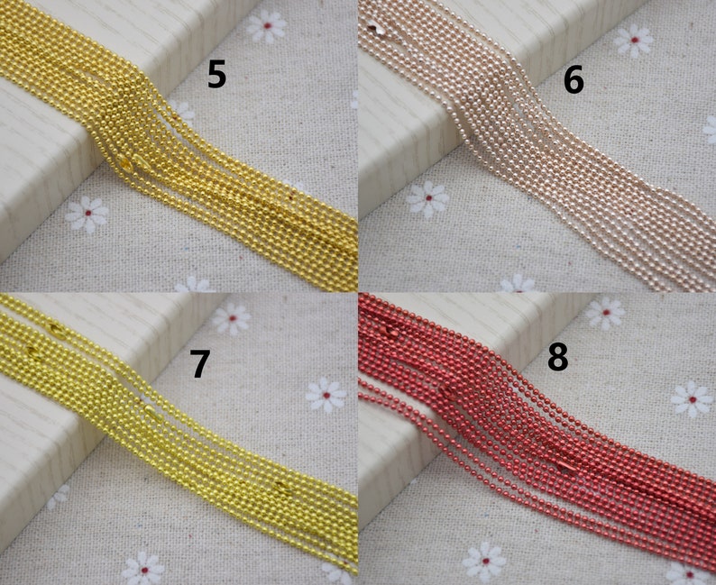 May include: A close-up of four different colored chains. The chains are made of small, round beads. The chains are arranged in rows, with the numbers 5, 6, 7, and 8 printed next to each row.