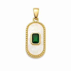 May include: An oval gold pendant featuring a central emerald-cut green gemstone set in a gold frame, surrounded by a white mother-of-pearl inlay and a beaded gold border. The pendant includes a gold bail at the top for attachment to a chain.