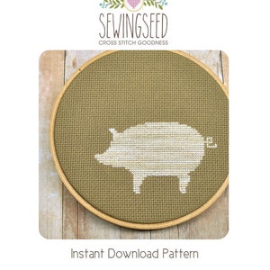 May include: A white pig cross stitch pattern in a brown embroidery hoop. The pattern is on a beige fabric background. The text "SewingSeed Cross Stitch Goodness" is above the hoop. The text "Instant Download Pattern" is below the hoop.