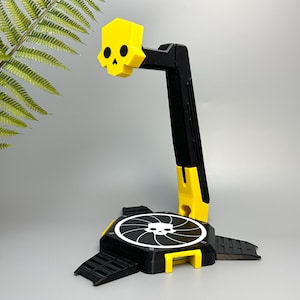 Soporte para auriculares y cargador inalámbrico con forma de calavera: Decoración para sala de juegos