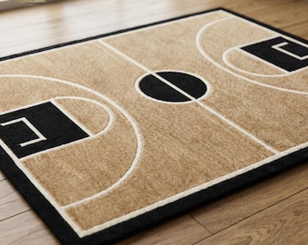 May include: A rectangular area rug featuring a tan basketball court design with black borders, black key areas, and a central black circle. The court markings are outlined in white, creating a clear graphic representation of a basketball court.
