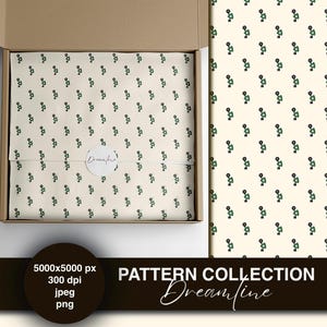 Könnte beinhalten: Eine Schachtel mit gemustertem Papier mit einem sich wiederholenden Design aus kleinen grünen und schwarzen Blumenformen auf cremefarbenem Hintergrund. Das Papier ist mit einem weißen Aufkleber mit der Aufschrift "Dreamline" gebunden. Das Bild zeigt auch ein sich wiederholendes Muster.