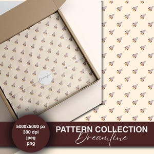 May include: A cardboard box with tissue paper featuring a repeating pattern of gray and yellow rockets. The tissue paper is wrapped around a product and sealed with a round sticker. The text "PATTERN COLLECTION Dreamfine" is visible.
