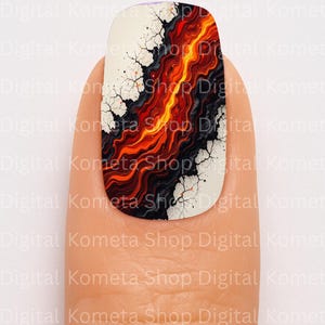 May include: A nail with a unique design featuring a fiery, abstract pattern in shades of red, orange, and black. The design is set against a white background with a cracked effect, and the nail is held by a finger. The text "Digital Kometa Shop" is visible.