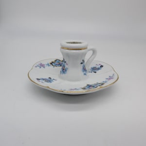 Vintage Limoges porcelain candle holder with floral design and gold rim, elegant French candlestick collectible