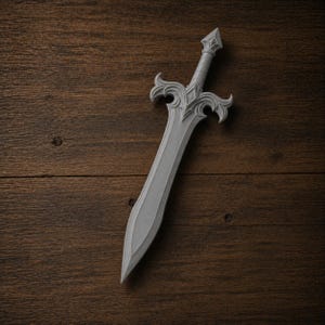 May include: A gray decorative sword with an ornate hilt and a pointed blade. The sword is made of a light gray material and is set against a dark wood background. The hilt features a diamond-shaped design.