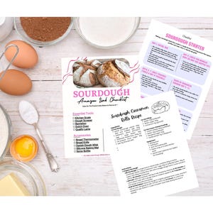 May include: A flat lay of sourdough baking ingredients and checklists. Ingredients include flour, eggs, butter, and cocoa powder. Checklists for sourdough starter and cinnamon rolls are visible, with the text "Sourdough Amazon Link Checklist."