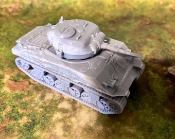 May include: A gray plastic model of a tank with a detailed turret and tracks.