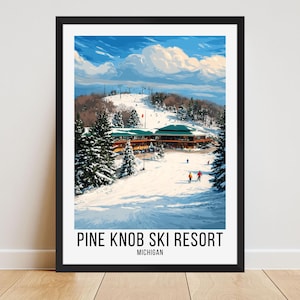 May include: A framed print of Pine Knob Ski Resort in Michigan. The artwork depicts a snowy mountain scene with skiers, a lodge, and a blue sky with clouds. The resort's name and location are printed at the bottom.