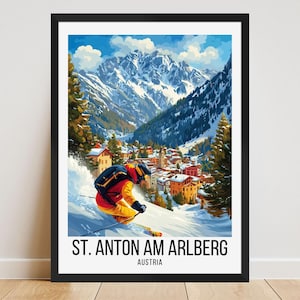 May include: A framed print of a vintage travel poster for St. Anton am Arlberg, Austria. The artwork depicts a skier in action on a snowy slope, with a village and snow-capped mountains in the background. The poster has a black frame.