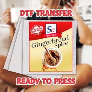 May include: A white DTF transfer sheet featuring a "Gingerbread Spice" design. The design includes a jar of spice with a spoon, cinnamon sticks, and the text "Spice Girls". The words "DTF TRANSFER" and "READY TO PRESS" are also displayed.