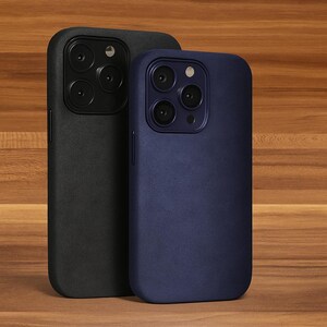 May include: Two phone cases, one black and one dark blue, with a textured finish. Both cases have a raised camera bump with three lenses.