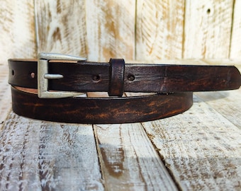 Distressed dark brown Narrow Leather Belt for men and women with a silver buckle.A Statement Piece for Your Jeans Stunning rough finish.