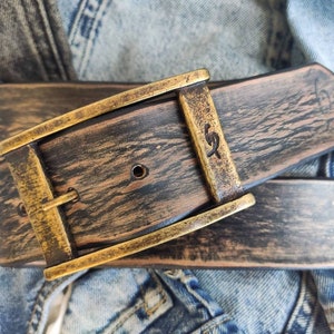 A black leather belt with brown spots that makes it look vintage simple black belt for jeans perfect for daily use and personalized option image 1