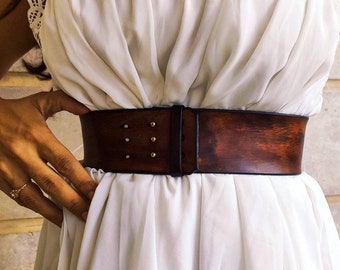 Brown leather waist belt with that has a unique decorative cord closure, perfect belt to wear with dress or jacket. vintage waist belt .