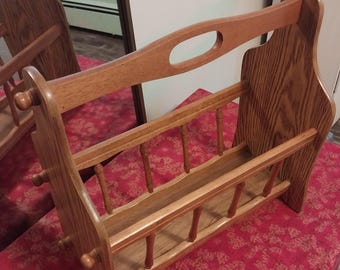 Vintage oak wooden magazine rack, with farmhouse style spindle details. Book, games, magazine storage.