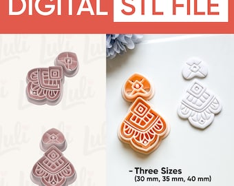 May include: Pink and white earring-shaped STL file cookie cutters in three sizes: 30 mm, 35 mm, and 40 mm. The cutters have sharp 0.4 edges and feature a detailed geometric design. The text "DIGITAL STL FILE" is at the top.