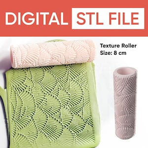 May include: A digital STL file for a texture roller. The image shows a light pink roller with a fan-like pattern, next to a green clay sheet with the same pattern. The roller is 8 cm in size.