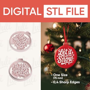May include: A digital STL file for a Christmas ornament. The ornament is round with the words "Let it Snow" in white script on a red background. The image also shows a pink ornament mold with the words "Let it Snow".