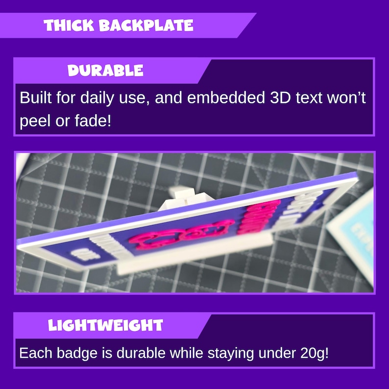 May include: A rectangular badge with a white frame, blue background, and pink 3D text. The text reads "GOOD". The badge is lightweight and durable, with a thick backplate. The text "Built for daily use, and embedded 3D text won't peel or fade!" is also visible.