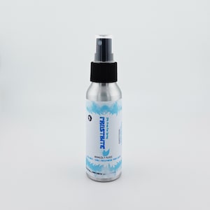 May include: A silver spray bottle with a black cap and nozzle. The label features the word "FROSTBITE" in blue, along with a blue wave design. The bottle contains 60ml (2.7 fl oz) of product.